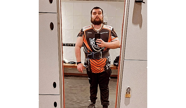 man standing in a mirror with a phone