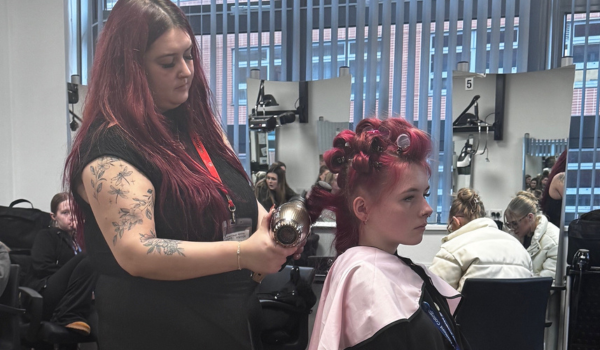 lady cutting other lady's hair
