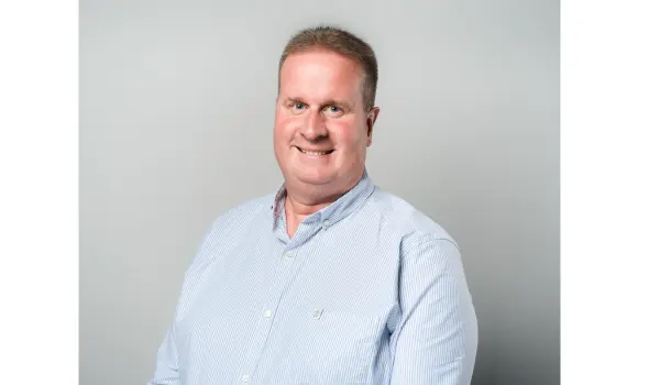 man in blue shirt smiling