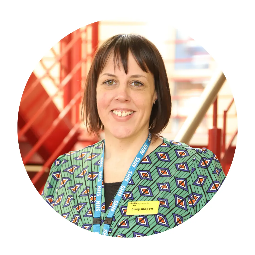 Lucy smiling at the camera