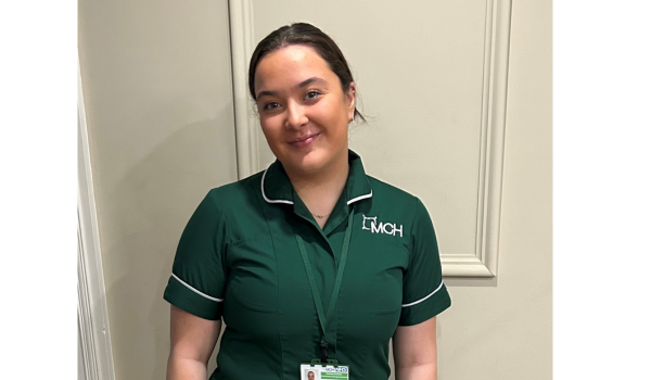 girl smiling wearing green