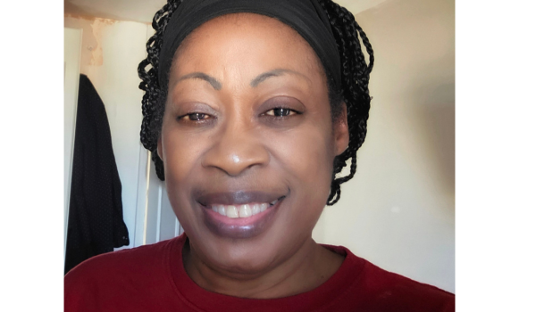 lady smiling at camera in red top