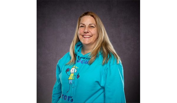 smiling lady with a blue top