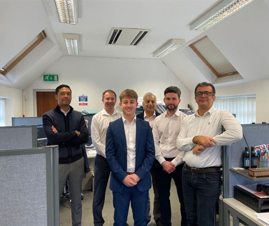 Photo caption – Henry Parmenter, centre, with colleagues.