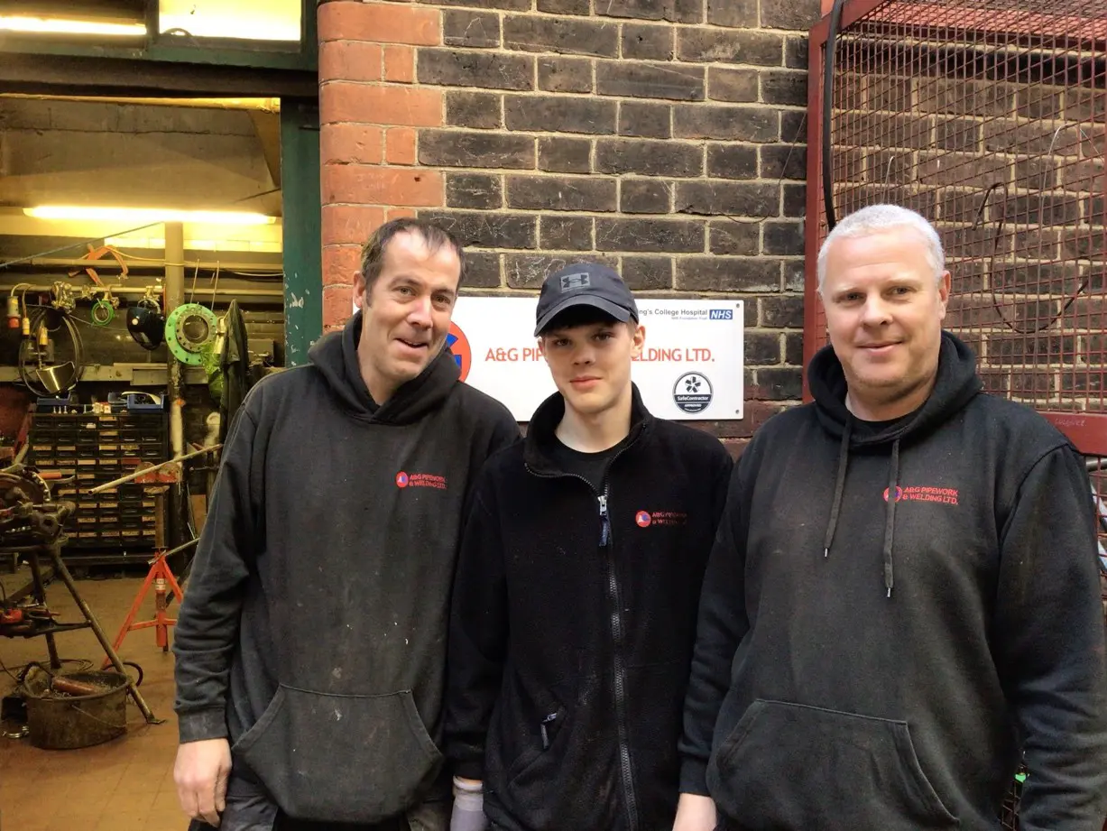 Student Blake and his team stood outside