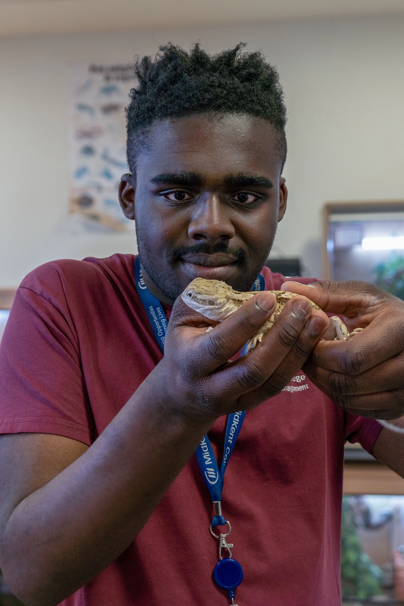 Student holding a lizard