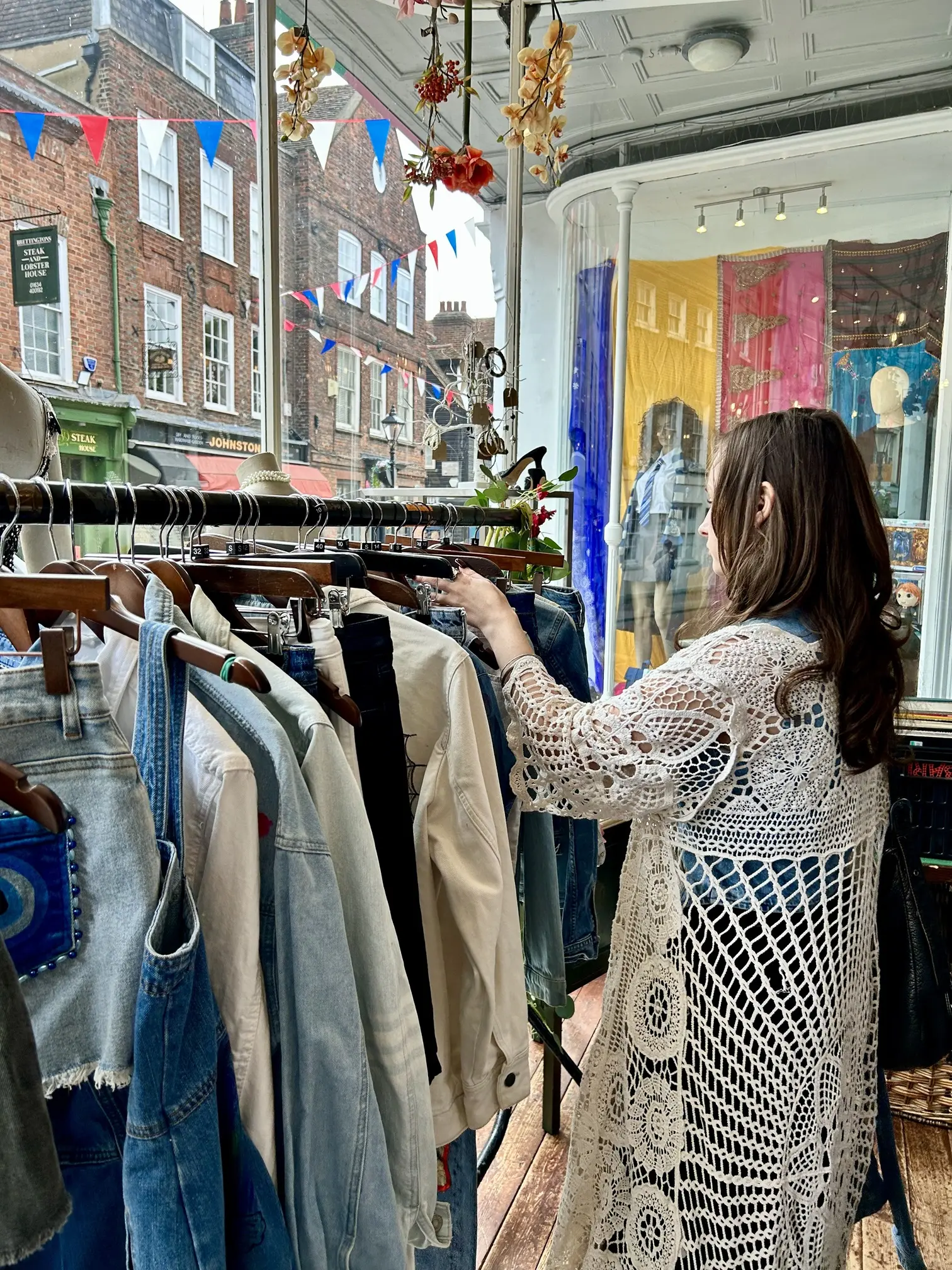 Denim clothes on rack