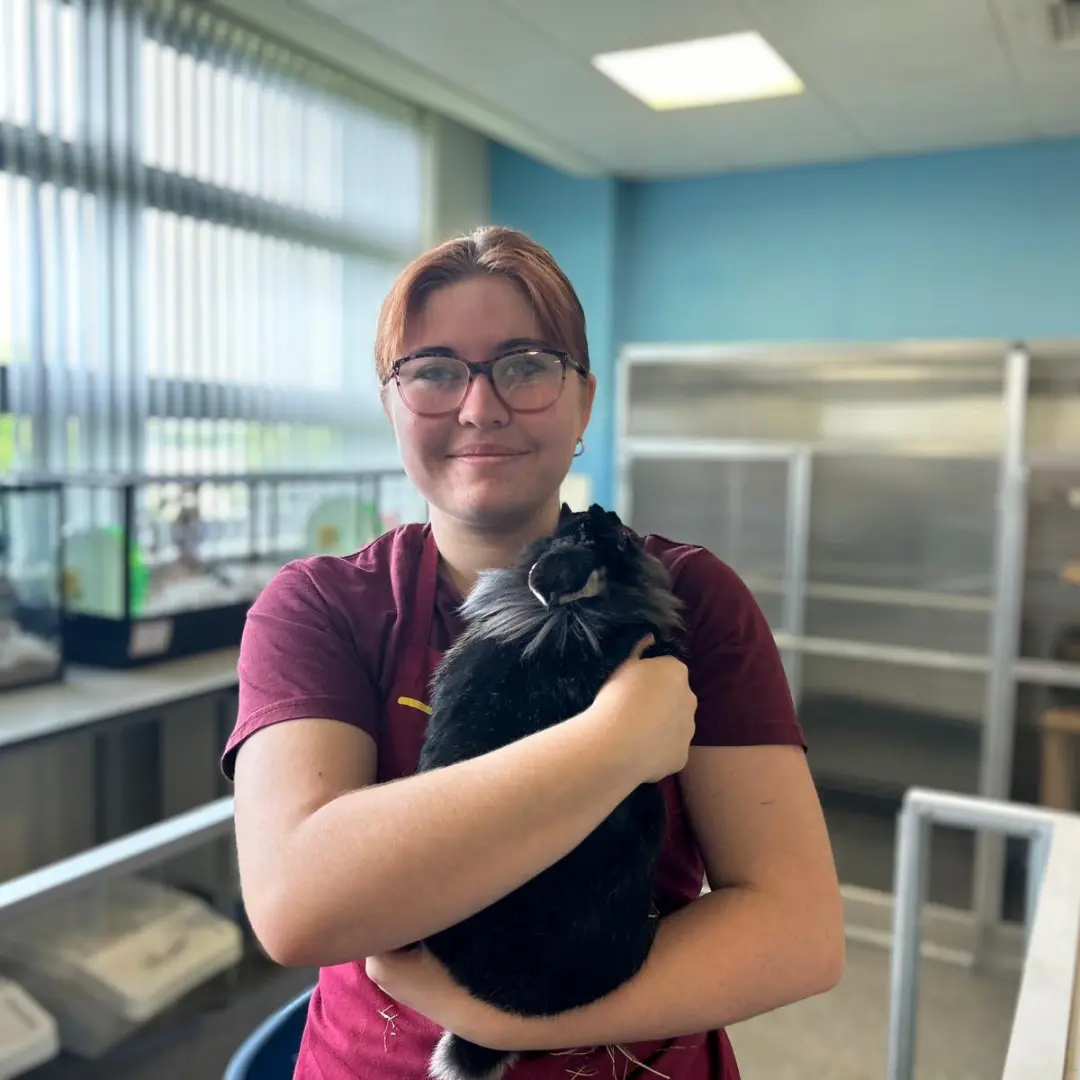 Student holding a rabbit