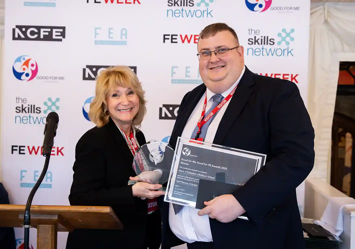 Lewis is presented with a national volunteering award