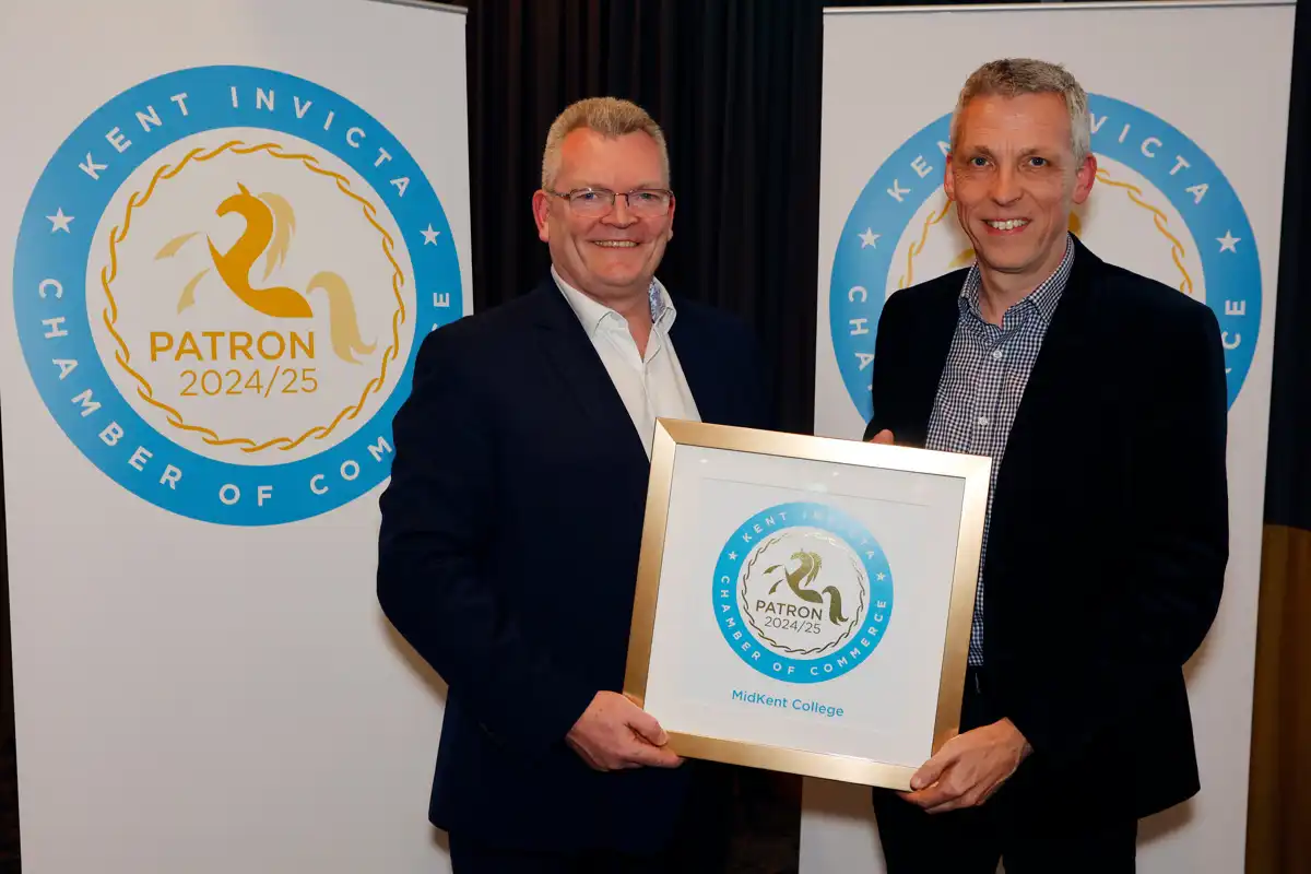 Chris Hare receiving the College's certificate of patronage