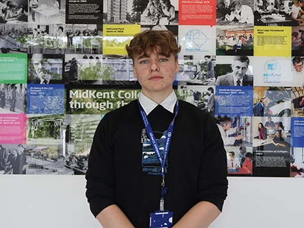 Student posing in corridor