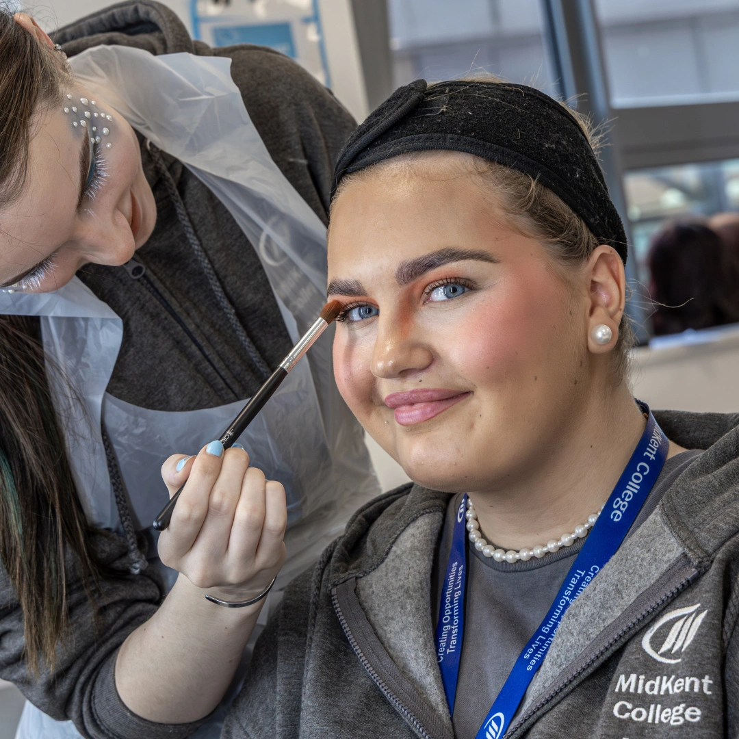 Student having make up done