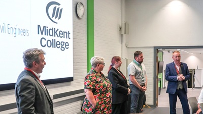 Staff and visitors enjoying presentation for ICE event