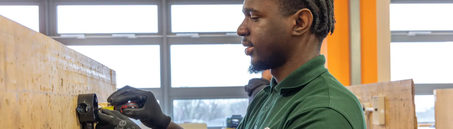 Electrical Installation student with tools