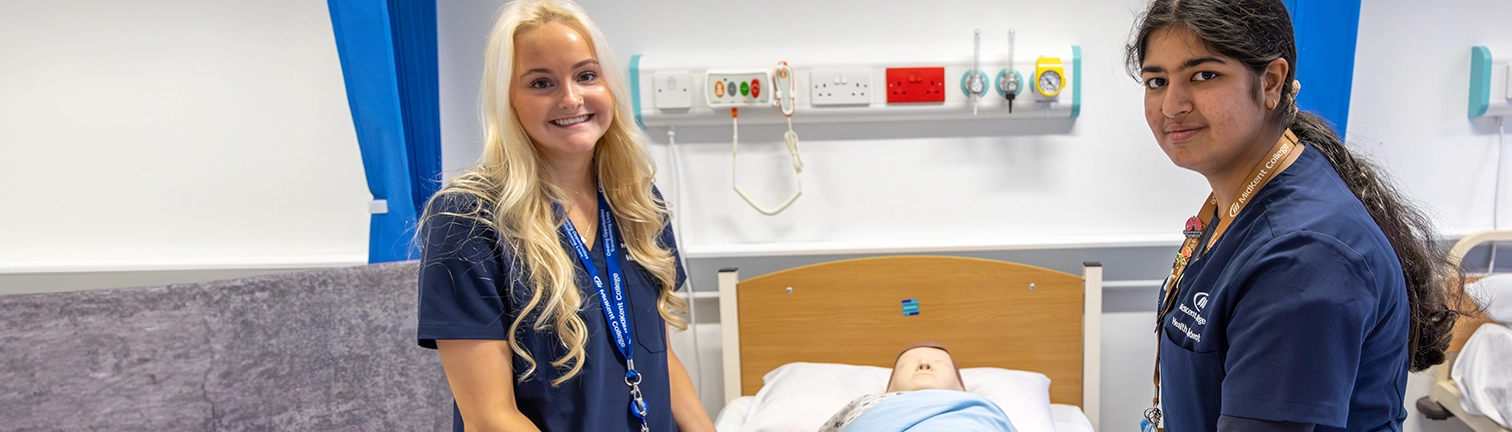 A selection of students from different subject areas smiling at the camera