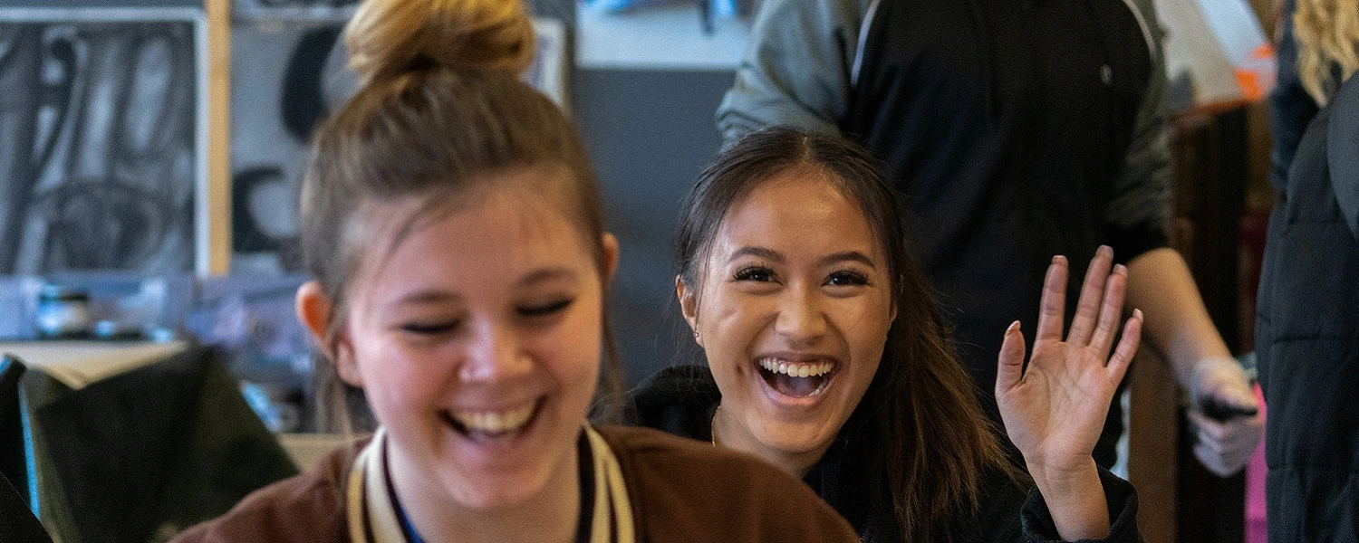 Motor Vehicle students smile at the camera