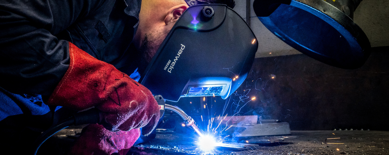Engineering student working on a piece of metal