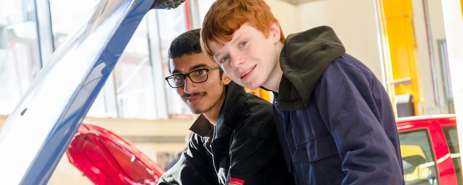 Motor Vehicle students work on a car