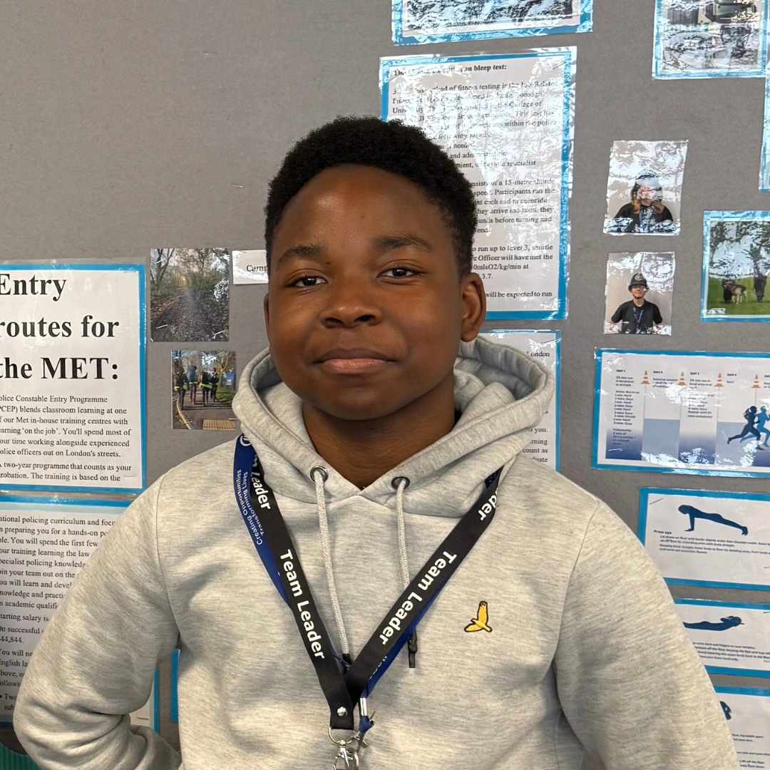 Craig posing in classroom
