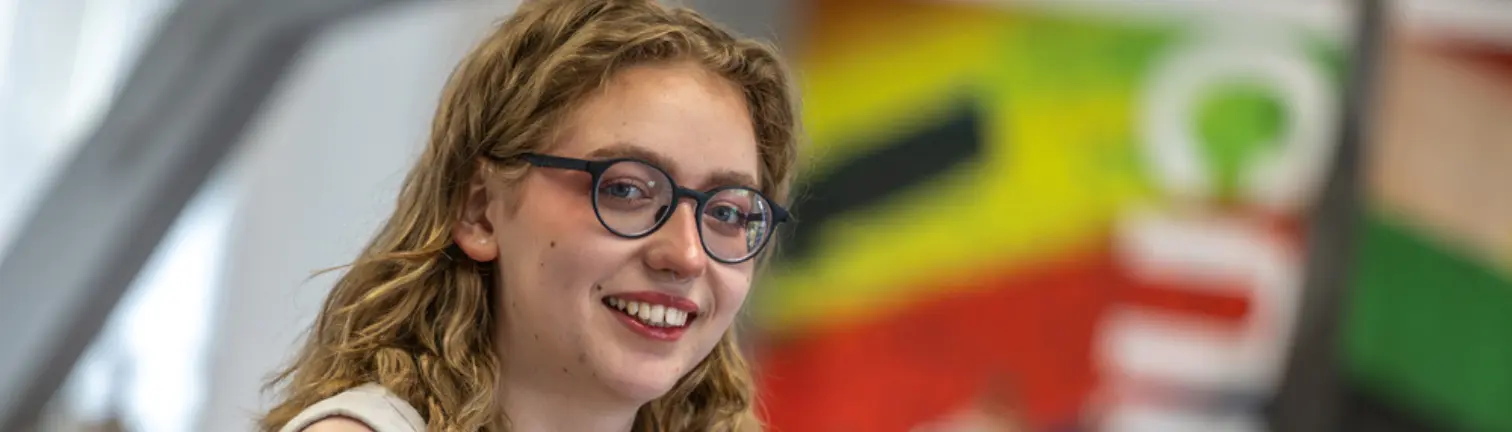 Student smiling at the camera