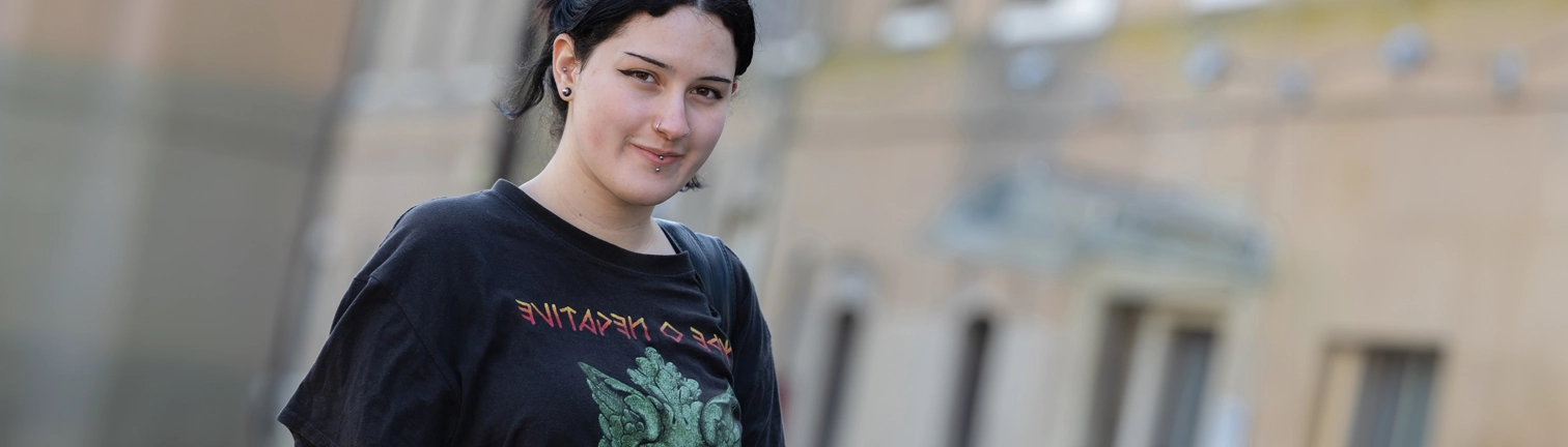 Student smiling at the camera