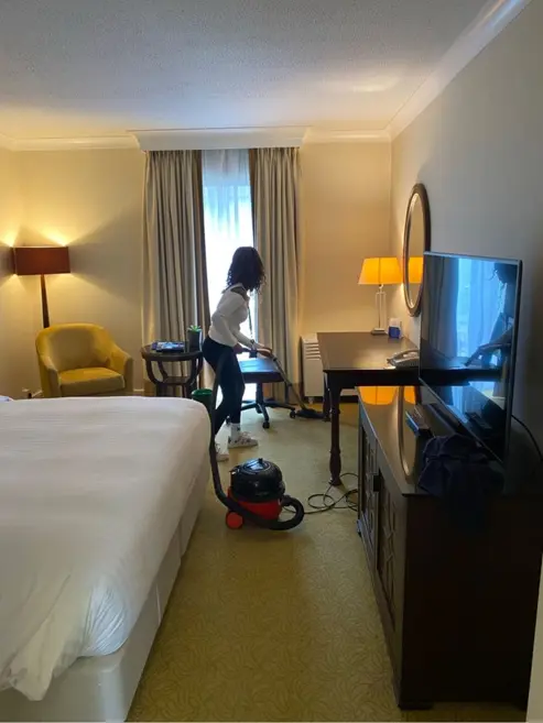 Student hoovering