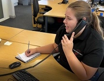 Isabel Judge uses the phone in her workplace