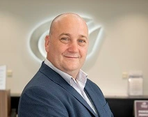 JJ smiling at the camera