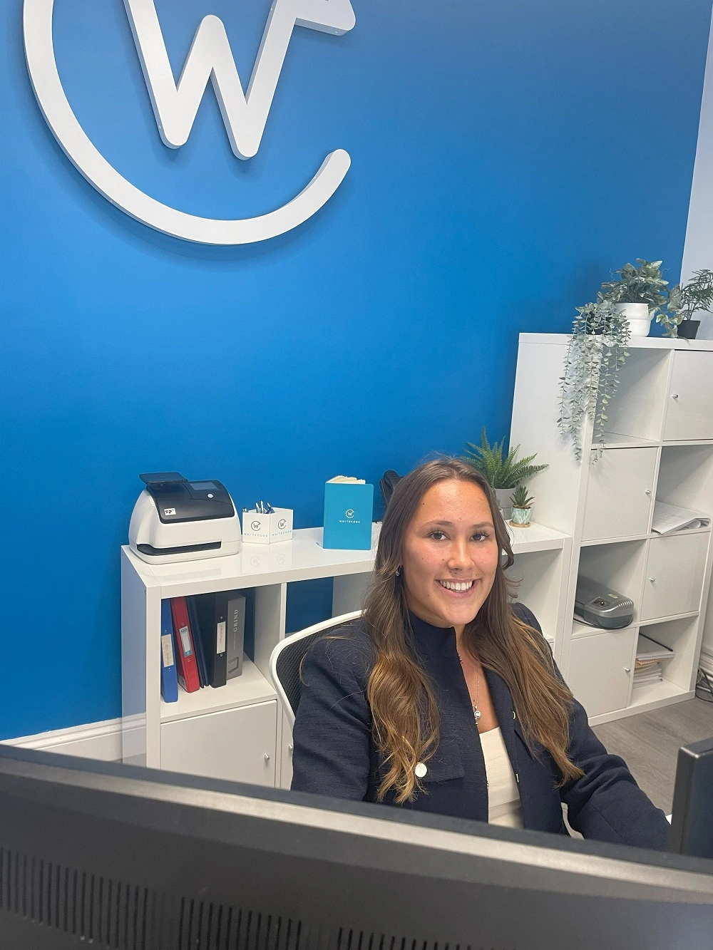 Libby Baker smiles in her workplace